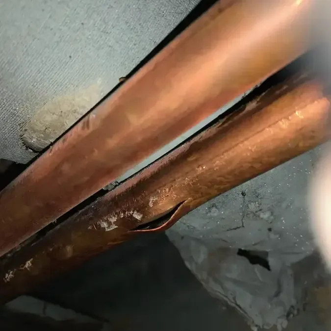 Ceiling stained and soaked by a pipe that froze and split